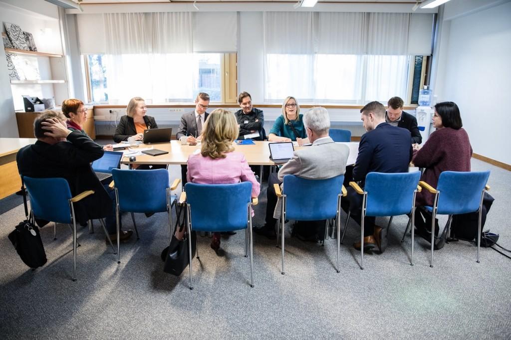 Politicians discussing around a table