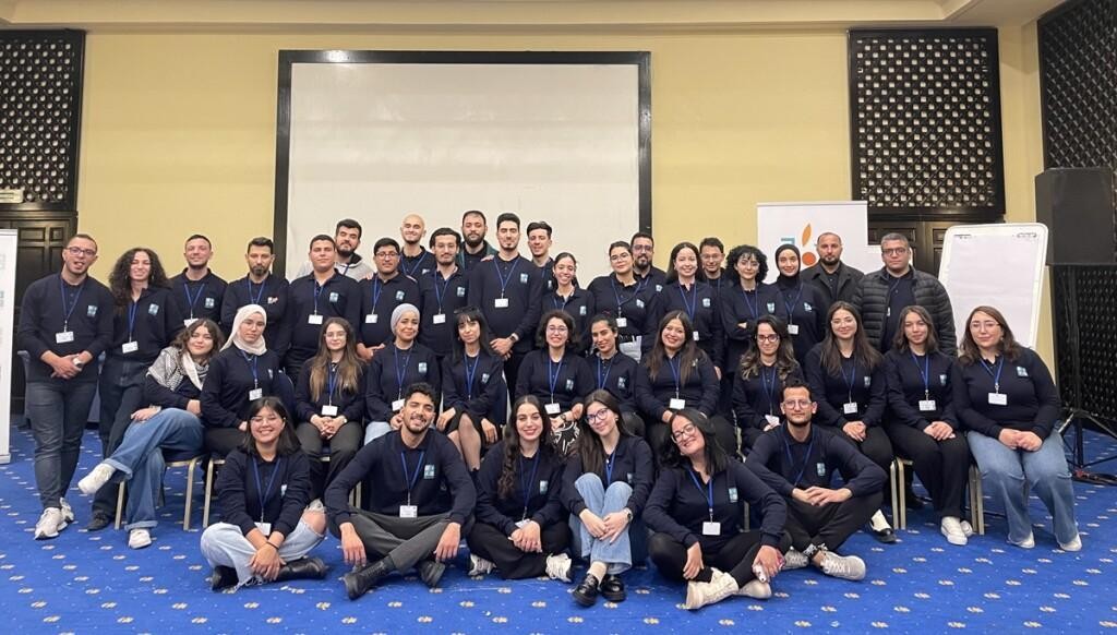 A group of almost 40 young people in similar sweatshirts.